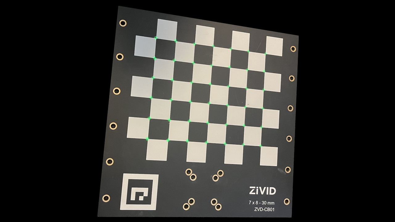 Green circles projected on the checkerboard corners of the Zivid calibration board