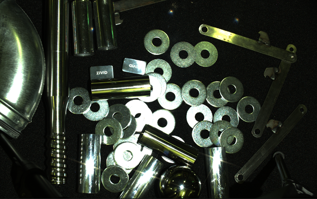 Picture of washers and cylinders with many highlight regions.